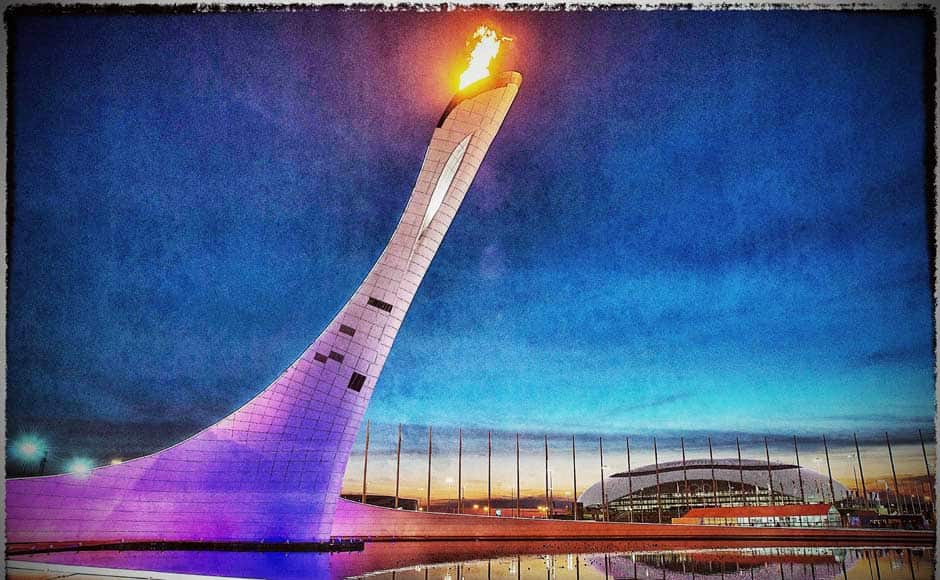 A general view of the Olympic Cauldron and flame with the Olympic Rings and the Bolshoy Ice Dome in the distance at sunset (This image was processed using digital filters). Getty Images