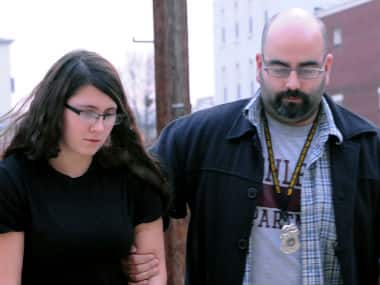 Miranda K. Barbour is led into District Judge Ben Apfelbaum’s office in Sunbury, Pa., by Sunbury policeman Travis Bremigen in this file photo. AP 