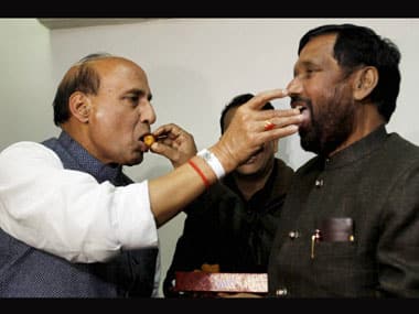 Rajnath Singh and Ram Vilas Paswan share sweets after confirming their alliance. PTI