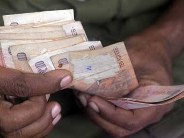 Old currency on the way out. AFP