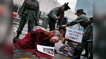China bristling, Spain seeks to curb its judges' international rights clout