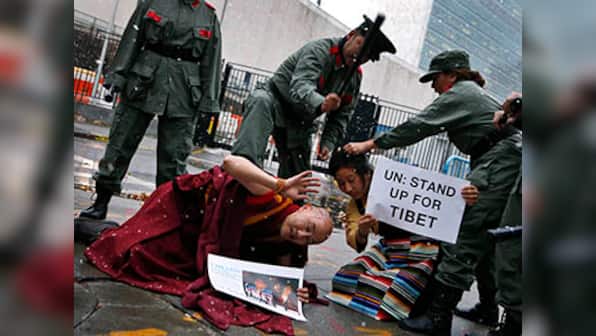 China bristling, Spain seeks to curb its judges' international rights clout