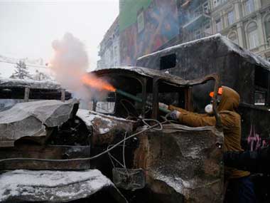 Protests in Ukraine have intensified with police raiding a camp: AP