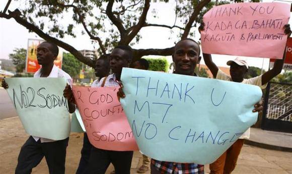 Anti-gay supporters celebrate after Uganda's President Yoweri Museveni signed a law imposing harsh penalties for homosexuality in Kampala. Reuters