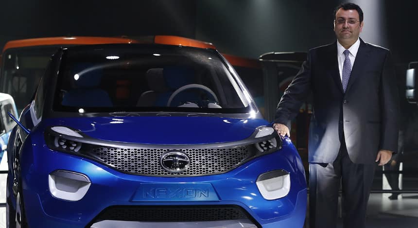 Tata Group Chairman Cyrus Mistry poses with Tata's Nexon concept car during the Indian Auto Expo in Greater Noida. (Image: Reuters)