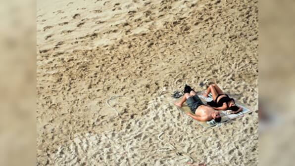 Love the new tan? You could be addicted to sunbathing!