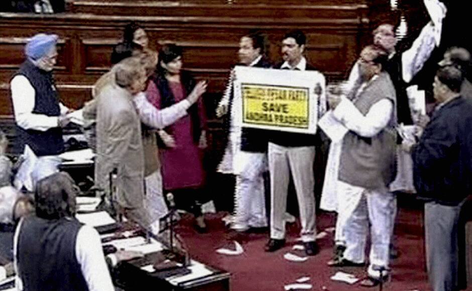 Members protest as Prime Minister Manmohan Singh speaks during the debate on Andhra Pradesh Reorganisation Bill, 2014 in Rajya Sabha in New Delhi on Thursday. PTI
