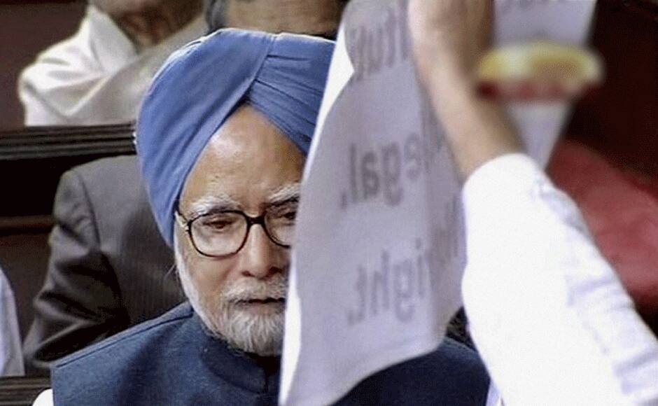 A member displays a placard as Prime Minister Manmohan Singh participates in the debate on Andhra Pradesh Reorganisation Bill, 2014 in Rajya Sabha in New Delhi on Thursday. PTI