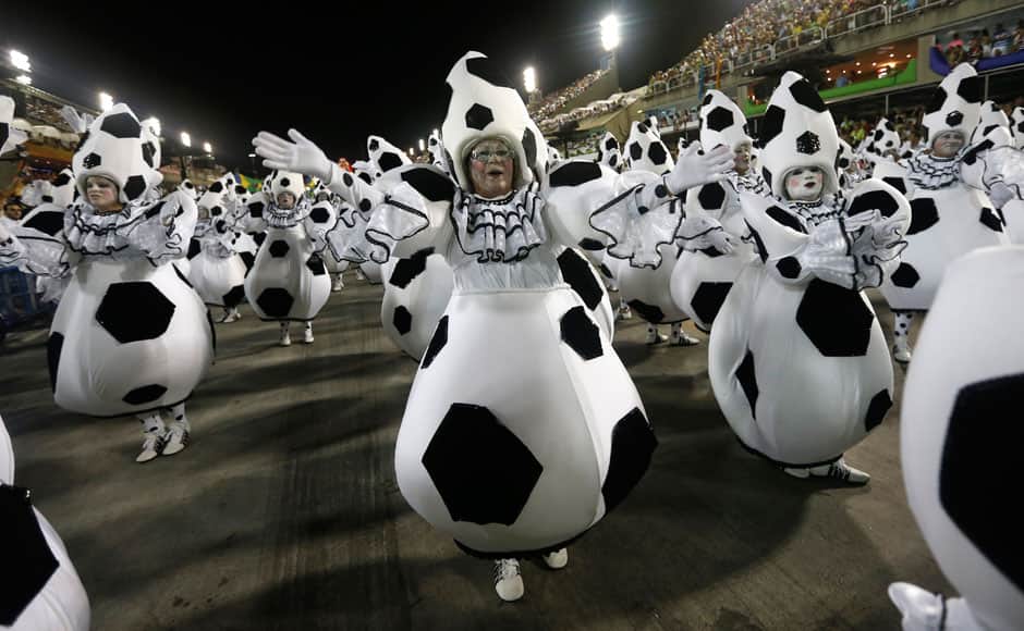 Performers from the Imperatriz Leopoldinense samba school parade during carnival celebrations at the Sambadrome in Rio de Janeiro, Tuesday, March 4, 2014. AP 