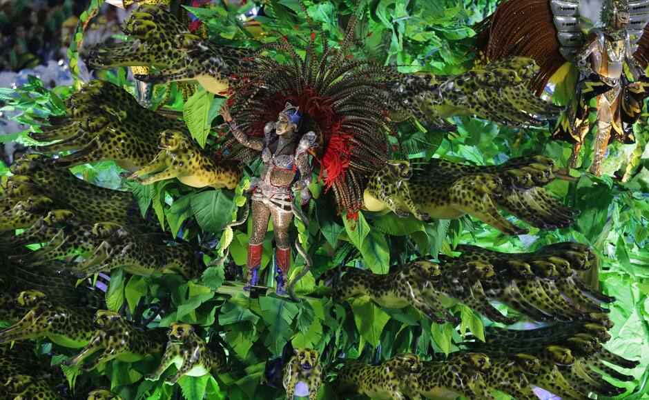 Performers from the Unidos da Tijuca samba school parade during carnival celebrations at the Sambadrome in Rio de Janeiro, Tuesday, March 4, 2014. AP