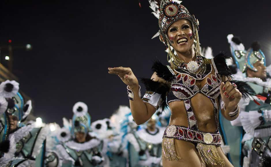 Performers from the Portela samba school parade during carnival celebrations at the Sambadrome in Rio de Janeiro, Tuesday, March 4, 2014. Brazil's Carnival is maintaining its frenetic pace, with hundreds of roving parties taking over Rio de Janeiro's streets and famed samba school parades heading into their final night. AP