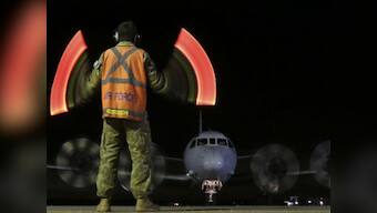 Search for flight MH370 will go on, promises Australian PM Abbott