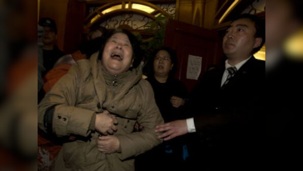 Relatives of passengers protest at Malaysia embassy in Beijing 
