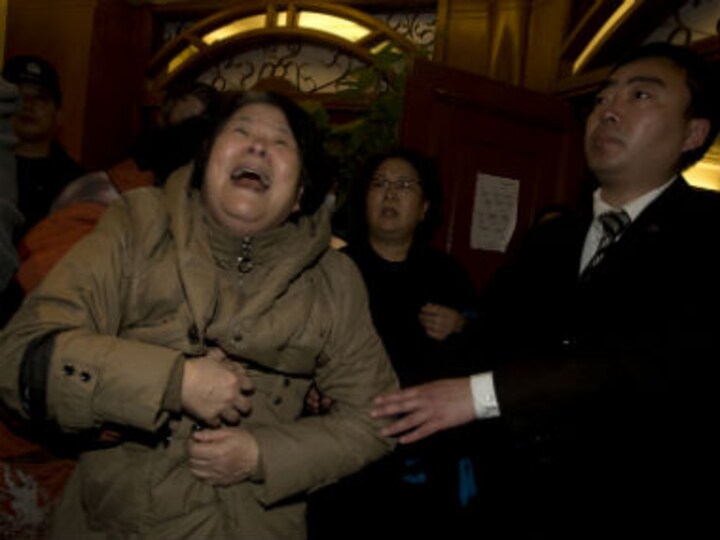 Relatives of passengers protest at Malaysia embassy in Beijing 