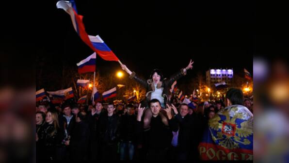 US, EU issue personal sanctions as Putin recognises Crimea 'sovereignty'