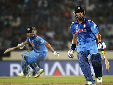 India's captain M.S Dhoni and Yuvraj Singh run between the wickets against Australia during their ICC Twenty20 World Cup match at the Sher-E-Bangla National Cricket Stadium in Dhaka. Reuters