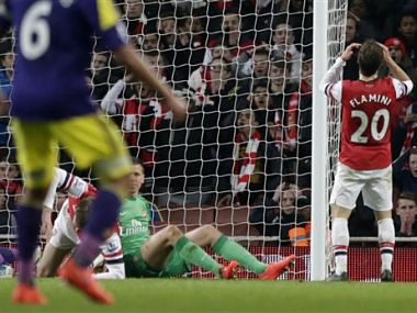 Late Flamini own goal dents Arsenal's title chances Late Flamini own goal dents Arsenal's title chances
