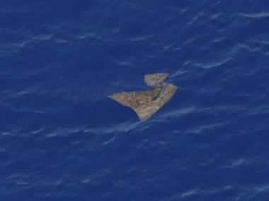 An object floats in the southern Indian Ocean in this picture taken from a Royal New Zealand Air Force P-3K2 Orion aircraft searching for missing Malaysian Airlines flight MH370. AFP