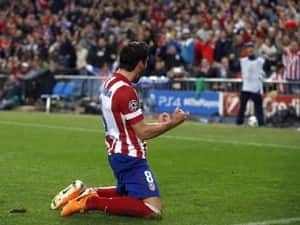 Atletico Madrid's Raul Garcia celebrates scoring a goal against AC Milan during their Champions League last 16 second match. REUTERS