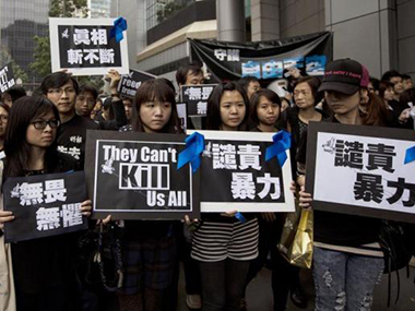 Thousands rally for press freedom after Hong Kong editor stabbed Thousands rally for press freedom after Hong Kong editor stabbed