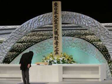 Japanese Prime Minister Shinzo Abe bows in front the altar for the victims of the March 11 2011 earthquake and tsunami at the national memorial service in Tokyo, Japan. AP 