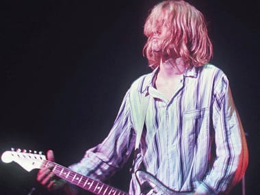 This photo taken 19 February 1992 shows Kurt Cobain, lead singer for the US grunge rockers Nirvana, performing at the Nakano Sun Plaza in Tokyo during their 1992 Asian-Pacific tour. AFP