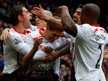 Liverpool celebrate during the match against Manchester United. Reuters