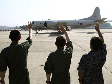 A Japanese warplane leaves for the search mission for MH370. AP