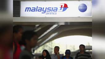 Floating 'yellow object' may be life raft from missing plane