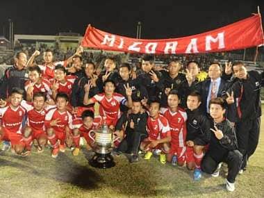 Football players of the Mizoram team celebrate after winning the final match of the 68th National Football Championship for the Santosh Trophy 2014. AFP