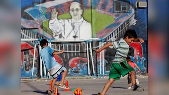On 1st anniversary, Pope Francis defends 'slum priests'