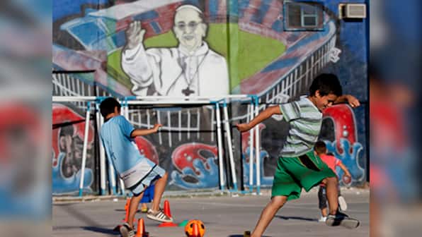 On 1st anniversary, Pope Francis defends 'slum priests'