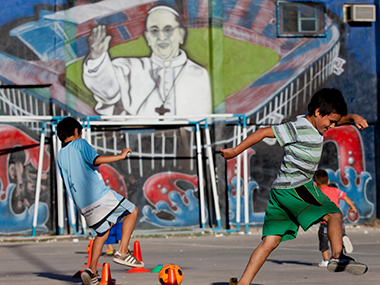 On 1st anniversary, Pope Francis defends 'slum priests' On 1st anniversary, Pope Francis defends 'slum priests'