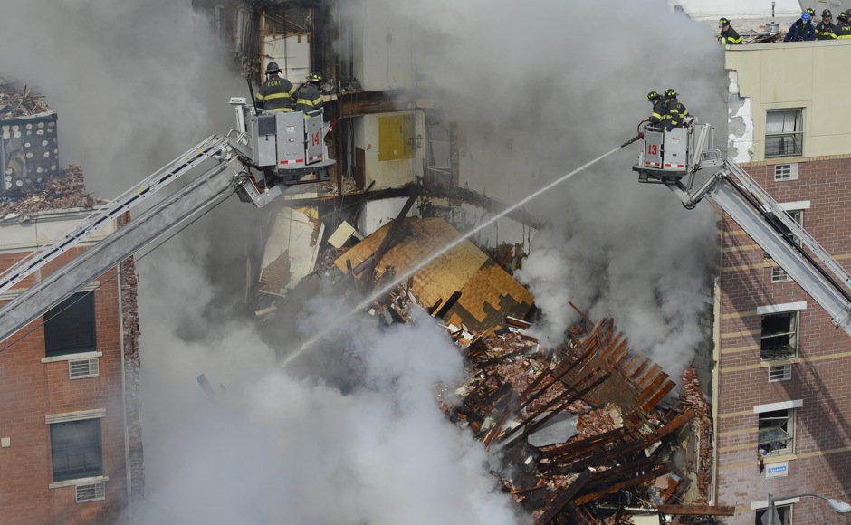Photos: Blast triggered by gas leak flattens two New York buildings Photos: Blast triggered by gas leak flattens two New York buildings