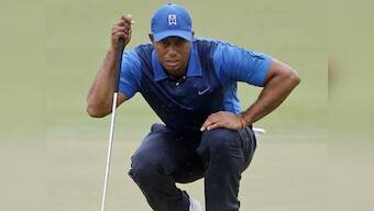 Woods trails by five after slow start at Cadillac Championship