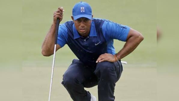 Woods trails by five after slow start at Cadillac Championship