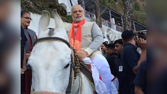 Modi reaches J&K in private jet, rides a horse to Vaishno Devi