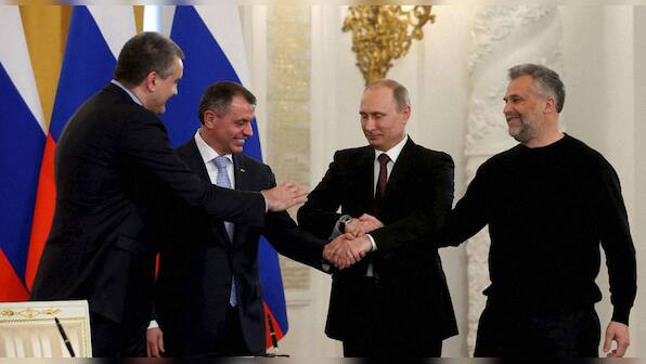 Deal sealed: Putin's expression sums up how Russia feels about Crimea's accession