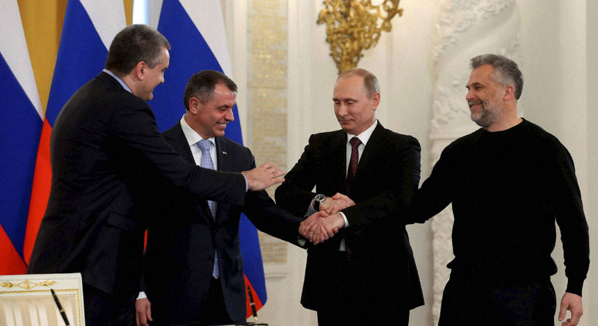 Deal sealed: Putin's expression sums up how Russia feels about Crimea's accession Deal sealed: Putin's expression sums up how Russia feels about Crimea's accession