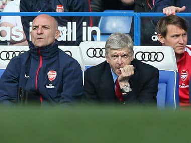 Arsenal's manager Arsene Wenger, left, watches his team play against Chelsea. AP