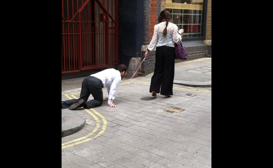 Photos Woman In London Goes For A Walk With A Man On Leash Photos News Firstpost