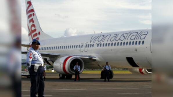 Aus passenger who caused Bali hijack scare charged on return home