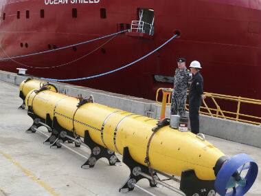 An autonomous underwater vehicle (AUV) sits on the wharf at naval base HMAS Stirling in Perth, Australia, ready to be fitted to the Australian warship Ocean Shield to aid in the search for missing Malaysia Airlines Flight MH370. AP