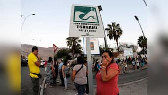 Chile evacuates coast as six feet tsunami waves follow quake