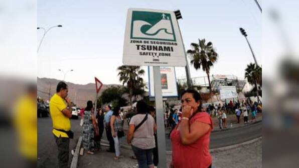 Chile evacuates coast as six feet tsunami waves follow quake