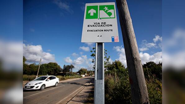 Chile assesses damage after massive quake, tsunami