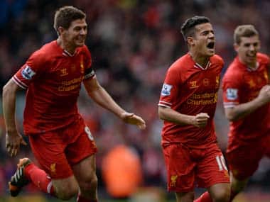 Liverpool celebrate after Philippe Coutinho scores their third goal. Reuters