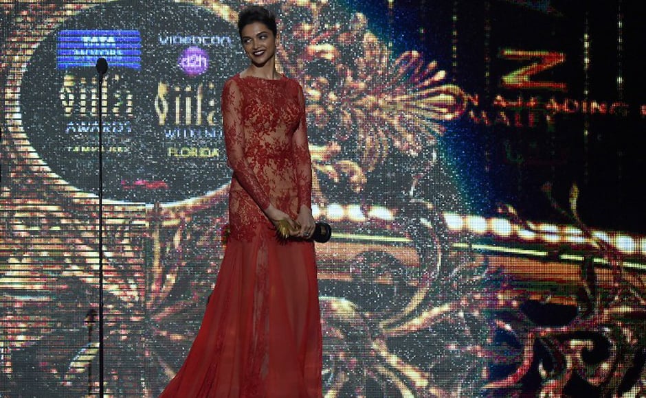 Deepika Padukone beams after receiving the award for Best Performance in a Leading Role (Female) for her role in Yeh Jawaani Hai Deewani. AFP.