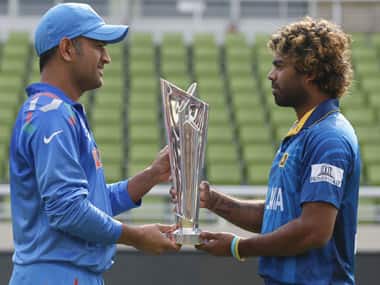 Dhoni and Malinga with the WT20 trophy. AP