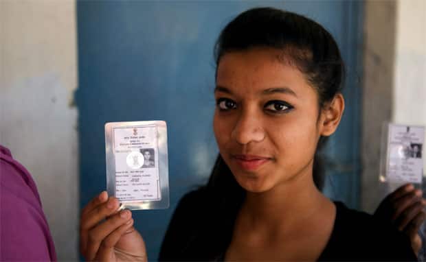 A First time voter in Delhi displays her ID card: Naresh Sharma/Firstpost
